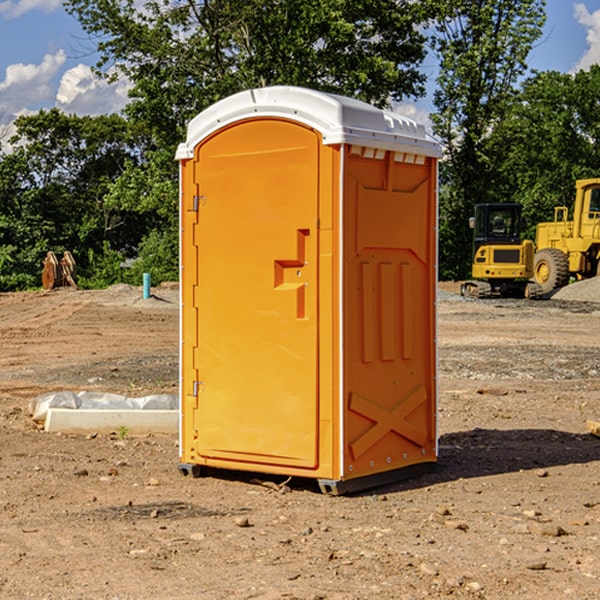 what is the cost difference between standard and deluxe portable toilet rentals in Huntland